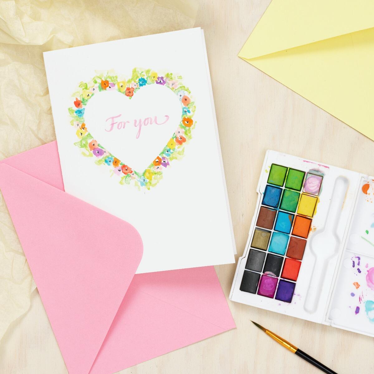 een valentijnskaartje met aquarelverf